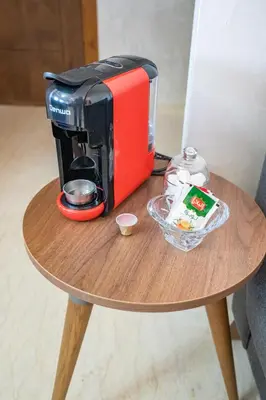 a coffee maker sitting on top of a wooden table at Appart Mayar 58 in Marrakech