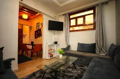 a living room with a couch and a table at La Nina Appartement Marrakech in Marrakech