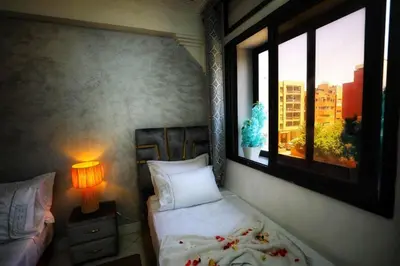 a bedroom with a bed and a window at La Nina Appartement Marrakech in Marrakech