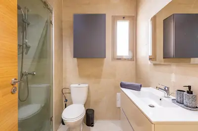 a bathroom with a toilet and a sink and a shower at New! Résidence de Luxe avec Piscine & parking in Marrakech