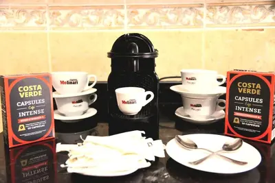 a group of cups and plates on a counter at Séjour Authentique à Marrakech Confort et Charme in Marrakech