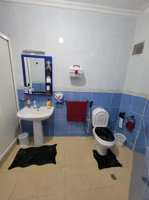 a bathroom with a toilet and a sink at Séjour Authentique à Marrakech Confort et Charme in Marrakech