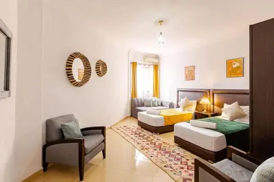 a living room with a couch and a chair at Séjour Authentique à Marrakech Confort et Charme in Marrakech