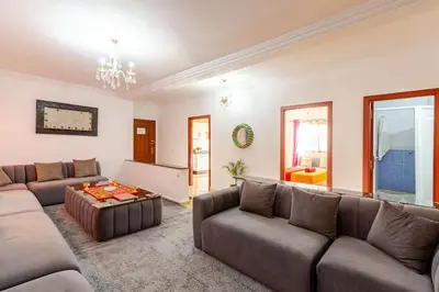 a living room with a couch and a table at Séjour Authentique à Marrakech Confort et Charme in Marrakech