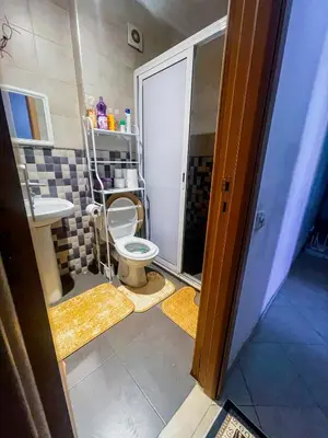a bathroom with a toilet and a sink at Your Home Away From Home in Marrakech