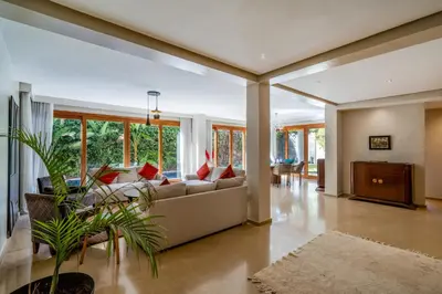 a living room with a couch and a table at Villa Dar Chama ,piscine privée , Au cœur de Marrakech in Marrakech