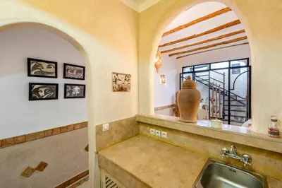 a kitchen with a sink and a vase on a counter at Dar Karole-Privé-petits déjeuners inclus in Marrakech