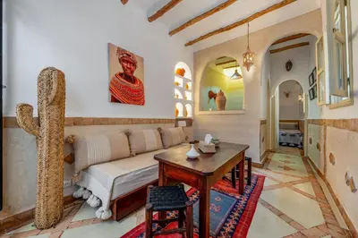 a living room with a couch and a table at Dar Karole-Privé-petits déjeuners inclus in Marrakech