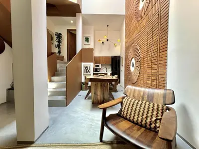 a living room with a bench and a table at Riad Ziya - Private very close to Jamaa El Fna in Marrakech