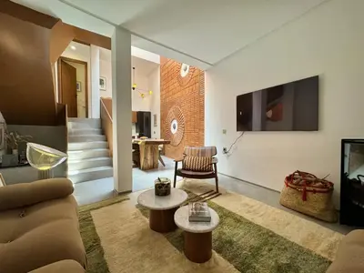 a living room with a couch and a tv at Riad Ziya - Private very close to Jamaa El Fna in Marrakech
