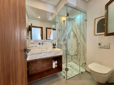 a bathroom with a shower and a sink and a toilet at Riad Ziya - Private very close to Jamaa El Fna in Marrakech