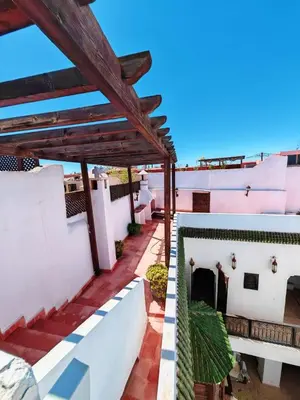 a view from the balcony of a house with a roof at Riad maison Bounouar in Marrakech
