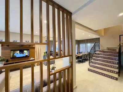 a lobby with a staircase and a living room at Villa Atlas view in Marrakech