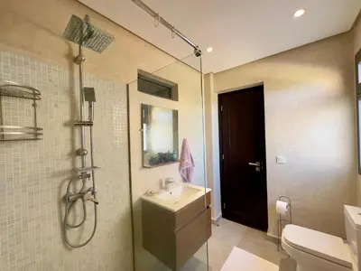 a bathroom with a sink and a shower at Villa Oasis in Marrakech