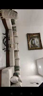 a room with a stairway with a picture on the wall at Élégant duplex avec deux piscines et une vue magnifique in Marrakech