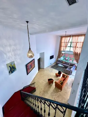 an overhead view of a living room with a chandelier at Duplex Mirador Majorelle in Marrakech