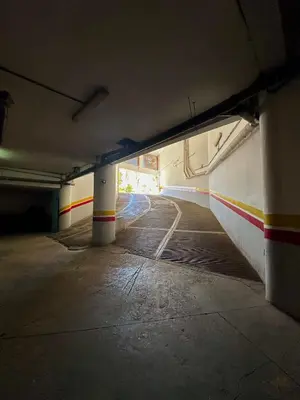 an empty tunnel with columns in a parking garage at Duplex Mirador Majorelle in Marrakech