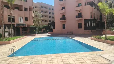 an empty swimming pool in front of a building at premium village M355 in Marrakech