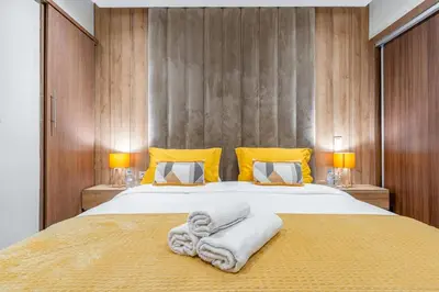 a bedroom with a large bed with towels on it at Appartement chic Gueliz kasbel 211 in Marrakech
