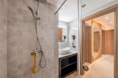 a bathroom with a shower and a sink at Appartement chic Gueliz kasbel 211 in Marrakech