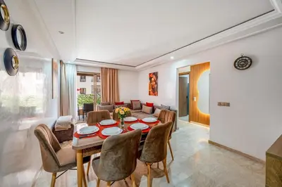 a dining room with a table and chairs at Appartement de prestige Gueliz kasbel 212 in Marrakech