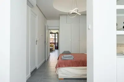 a bedroom with a bed and a ceiling fan at appartement hyper centre in Marrakech