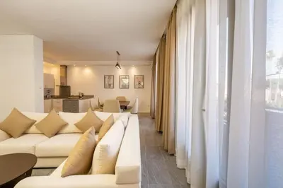 a living room with a white couch and a table at appartement hyper centre in Marrakech