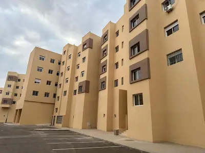 a row of tall buildings in a parking lot at Liton's Avenue in Marrakech
