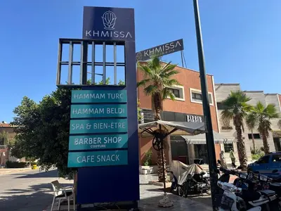 a sign for a coffee shop on a street at Liton's Avenue in Marrakech