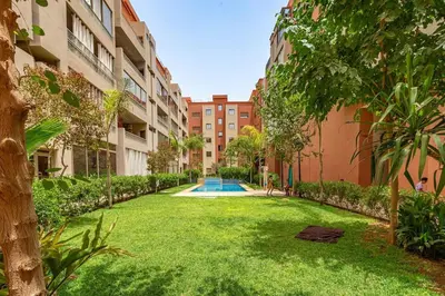 an empty yard in a courtyard of a building at New! App Émeraude Confort avec piscine & parking in Marrakech