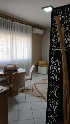 a living room with a table and a couch at APPARTENT 11 à GUELIZE HIVERNAGE in Marrakech