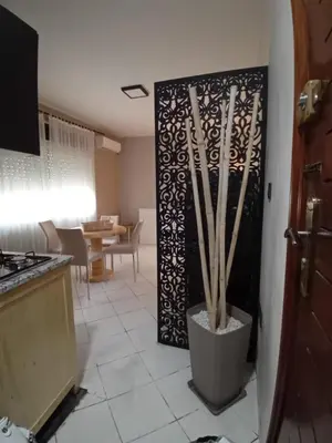 a kitchen with a door to a living room at APPARTENT 11 à GUELIZE HIVERNAGE in Marrakech