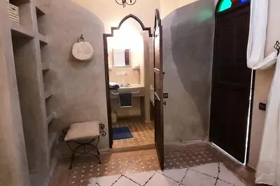 a bathroom with a sink and a mirror at Riad Cosy in Marrakech