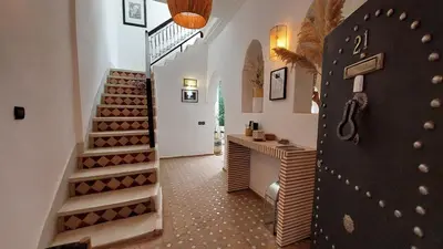 a room with a bunch of wine racks and stairs at Riad Cosy in Marrakech