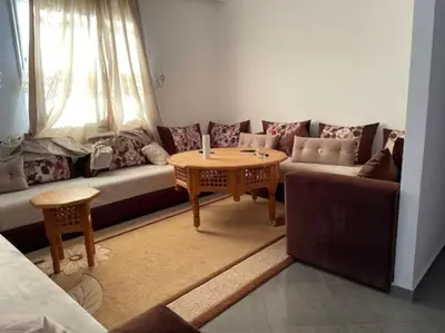 a living room with a couch and a table at Appartement Chic à Marrakech in Marrakech