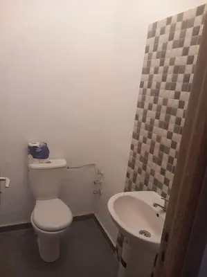 a small bathroom with a toilet and a sink at Appartement Chic à Marrakech in Marrakech