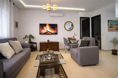 a living room with a couch and a table at Luxury Apartment in Hivernage Marrakech in Marrakech