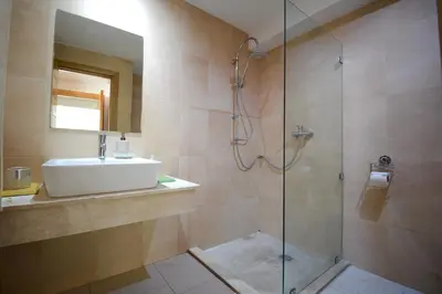 a bathroom with a sink and a shower at Appart charmante au cour de marrakech l'hivernage in Marrakech