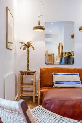 a living room with a couch and a chair at Riad YANNIS in Marrakech