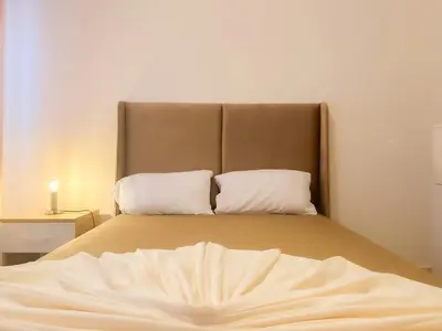 a bed with two pillows on it in a room at L'Havre de Paix - Proxi Centre - 2 Chambres in Marrakech