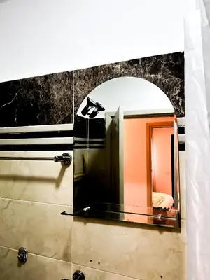 a mirror on a wall in a bathroom at L'Havre de Paix - Proxi Centre - 2 Chambres in Marrakech
