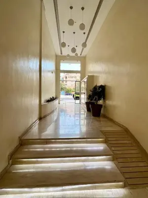 a hallway with stairs in a building at Appartement 2 chambres Luxueuse centre Guéliz opr 15 in Marrakech
