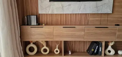 a cabinet with a tv and some vases on it at Firstwood Chic Apartment Hivernage in Marrakech