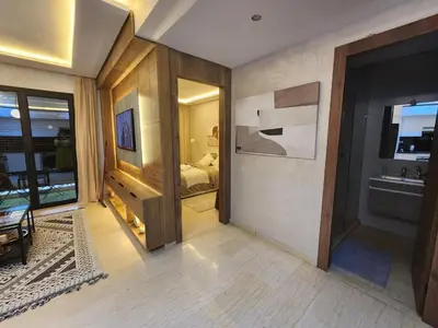 a room with a bedroom with a bed and a sink at Firstwood Chic Apartment Hivernage in Marrakech