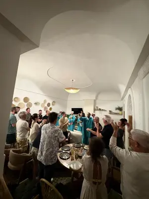 a group of people standing in a room with a band at Riad Tamazigh in Marrakech