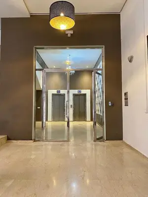 an empty hallway with a glass door in a building at Apparemment 1 chambre salon à coté de la gare guéliz 20 in Marrakech