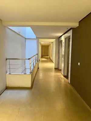 an empty hallway of a building with a stairway at Apparemment 1 chambre salon à coté de la gare guéliz 20 in Marrakech