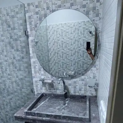 a man taking a picture of a bathroom mirror at Apartment in Marrakech - WiFI - IPTV Movies - equipped - free parking in Marrakech