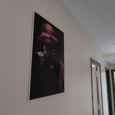 a picture of a woman with a butterfly on a wall at Apartment in Marrakech - WiFI - IPTV Movies - equipped - free parking in Marrakech