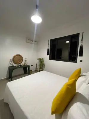 a yellow banana sitting on top of a bed at Superbe studio en plein centre in Marrakech